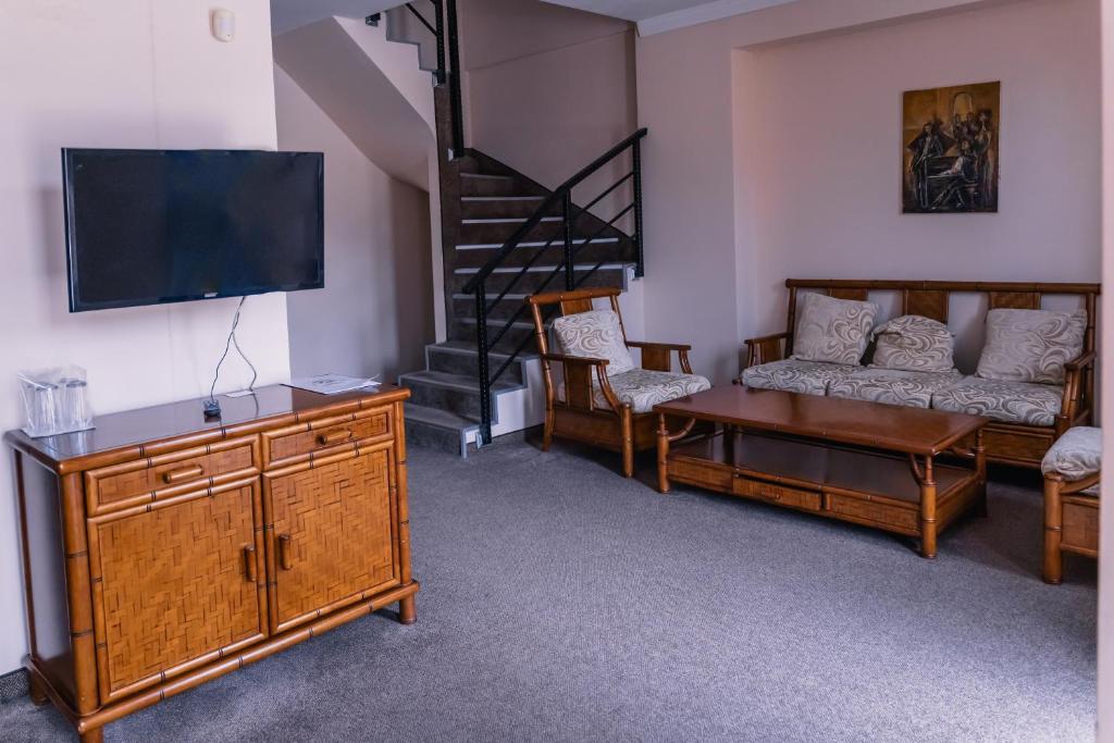 TV a/nebo společenská místnost v ubytování Hotel Orbel