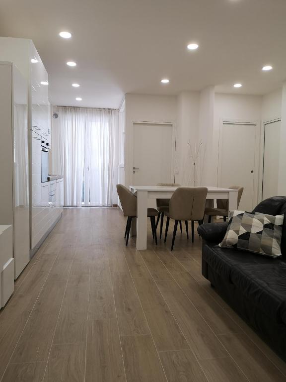 a living room with a table and a couch at Appartamento Filo in Castel di Sangro