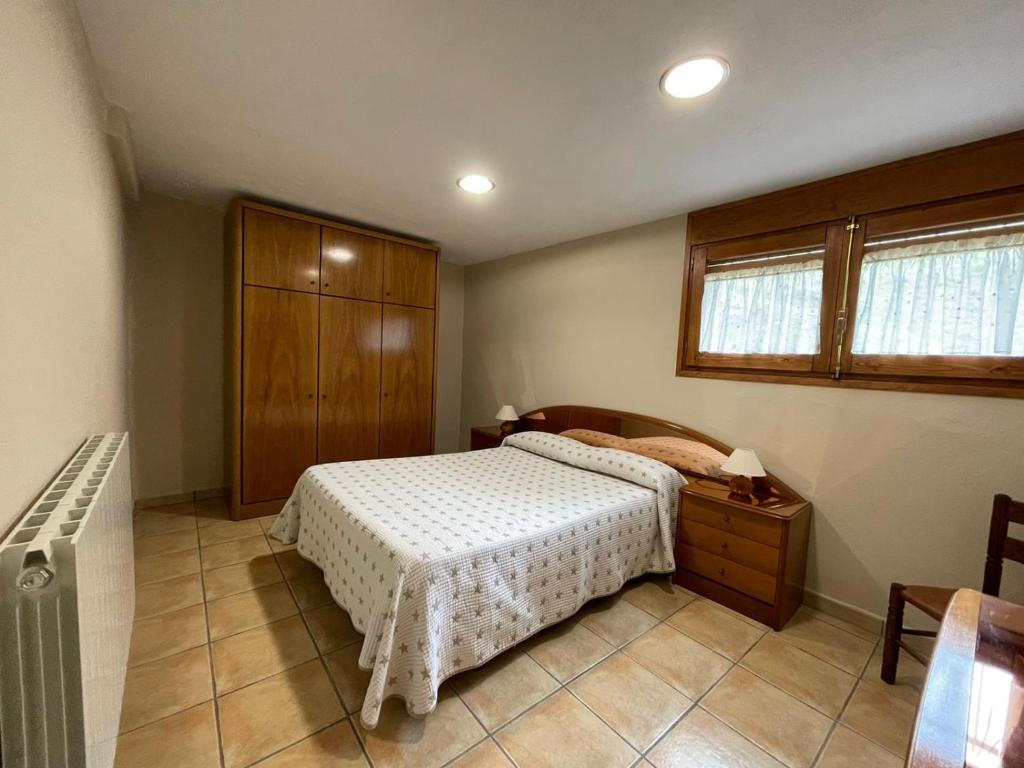 Llit o llits en una habitació de La Badia Nova