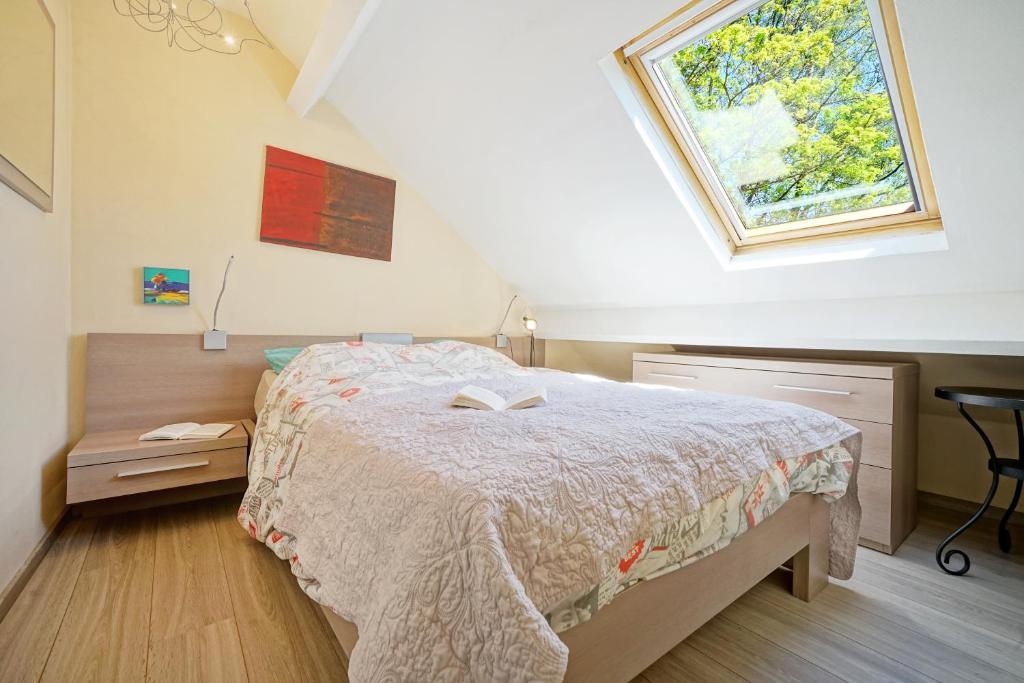 Postel nebo postele na pokoji v ubytování Le Clos Arboré (Gîte)