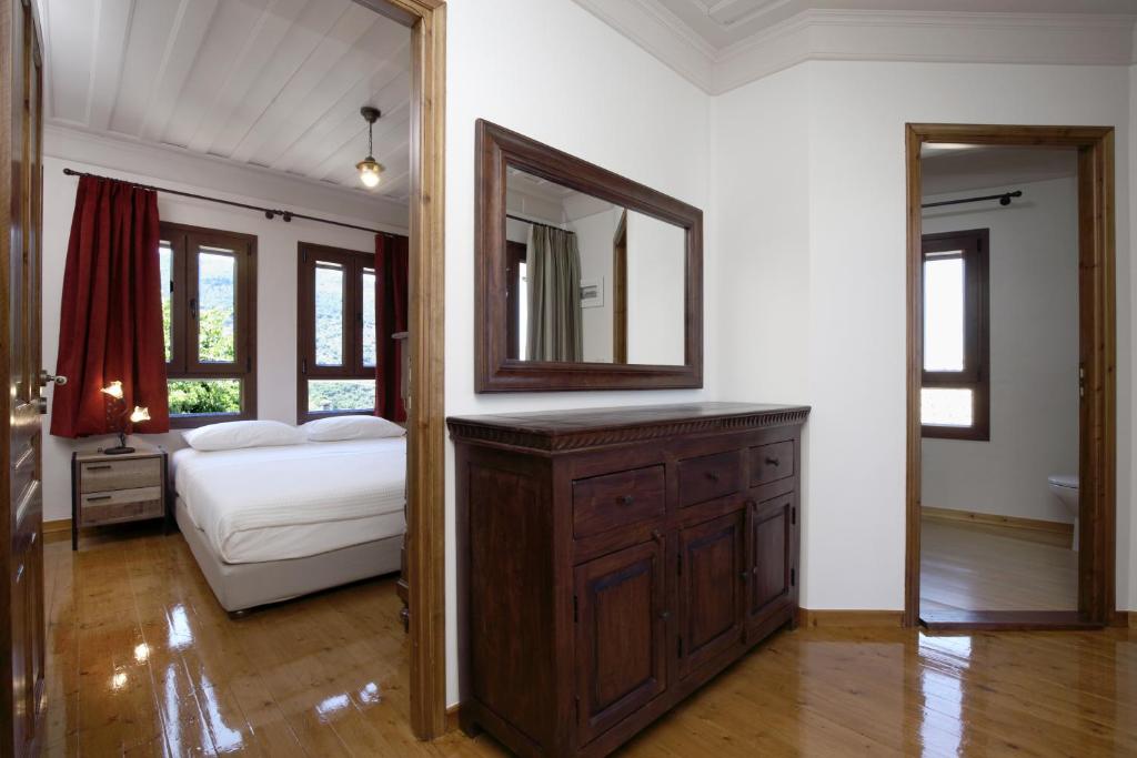 A bed or beds in a room at Stafilos House