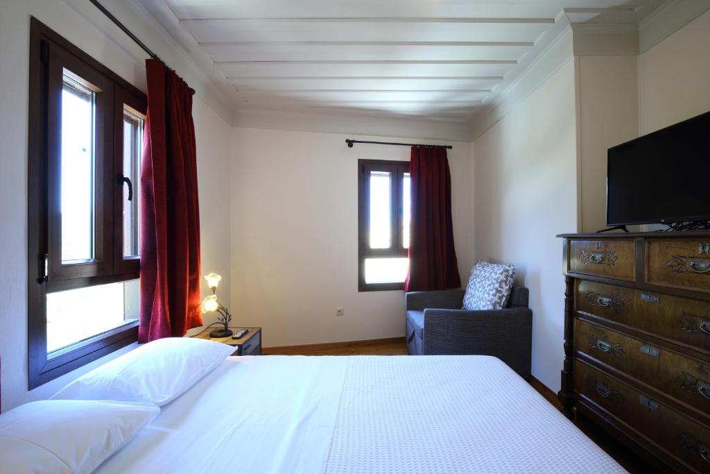 A bed or beds in a room at Stafilos House