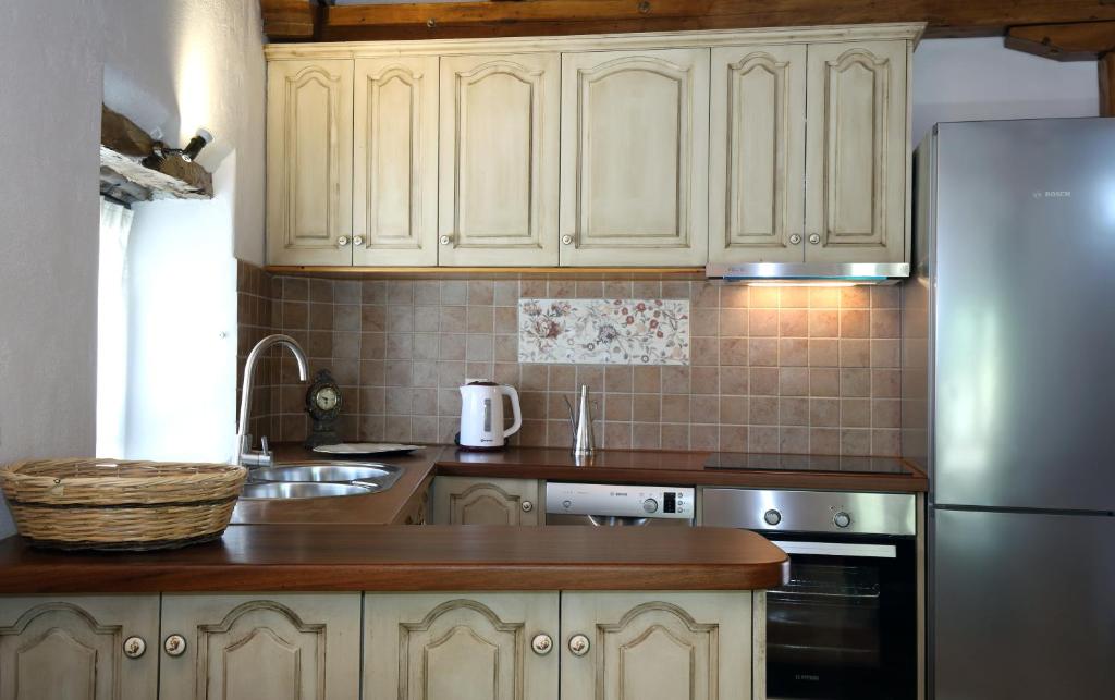 A kitchen or kitchenette at Stafilos House