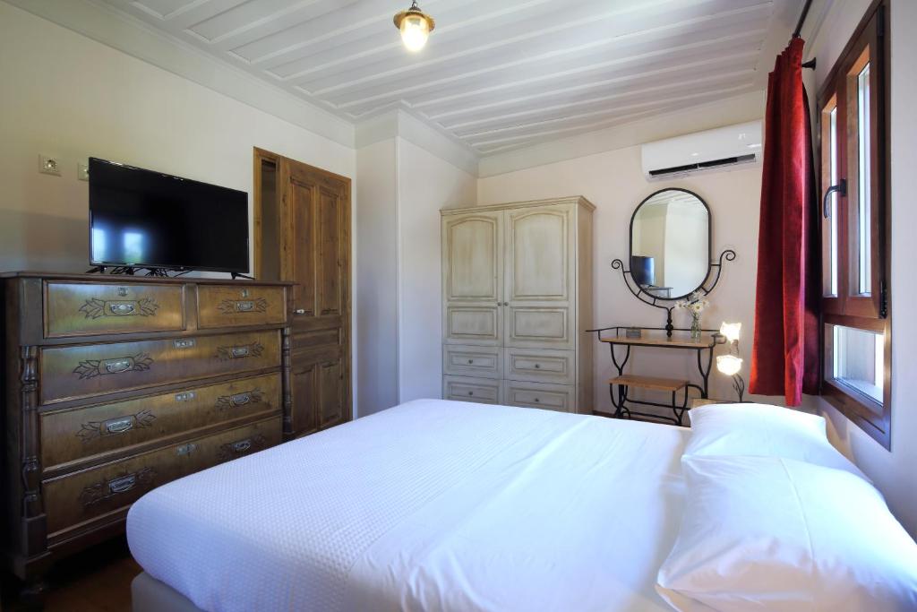 A bed or beds in a room at Stafilos House