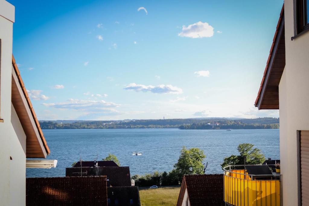 a view of a large body of water from a building at See-Charme in Uhldingen-Mühlhofen