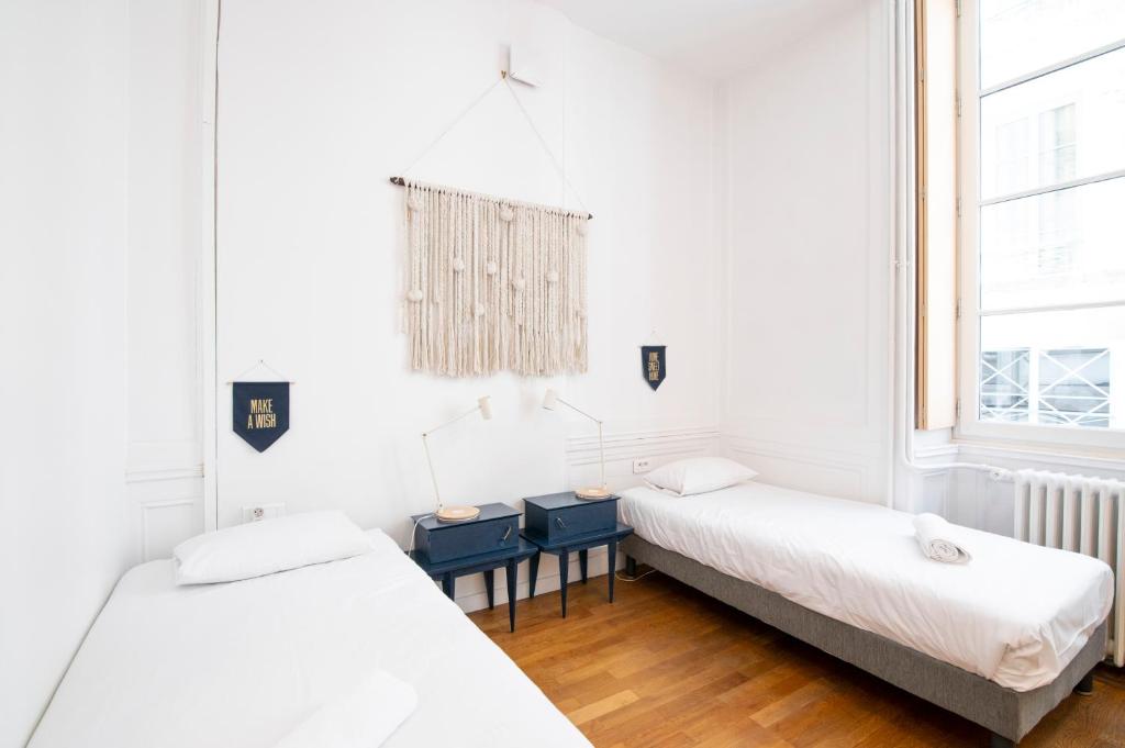 Postel nebo postele na pokoji v ubytování SLO Hostel Lyon les Pentes