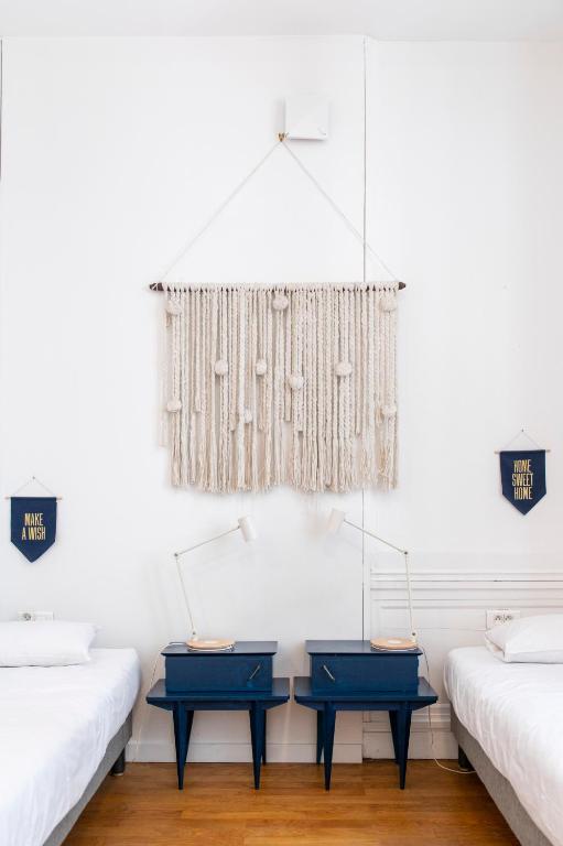 Postel nebo postele na pokoji v ubytování SLO Hostel Lyon les Pentes