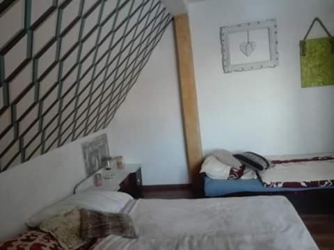 Säng eller sängar i ett rum på Schronisko Srebrny Potok