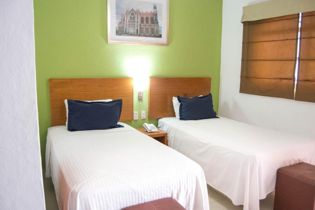 Postel nebo postele na pokoji v ubytování Hotel River Poliforum