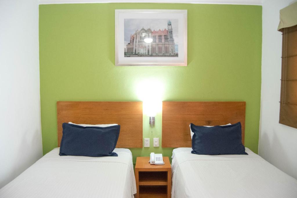 Postel nebo postele na pokoji v ubytování Hotel River Poliforum