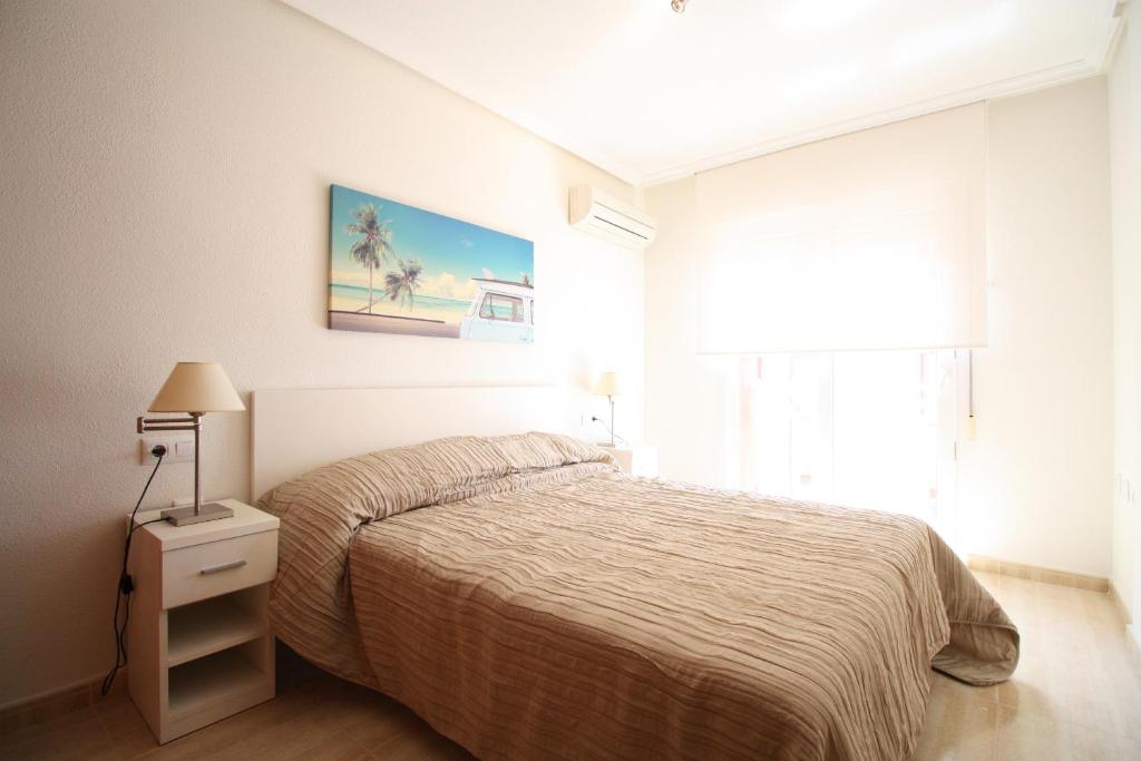 A bed or beds in a room at Spanish Connection - Seychelles