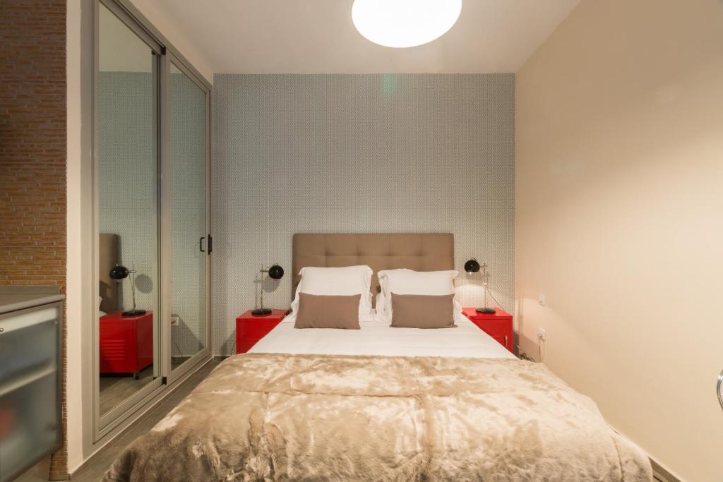 Postel nebo postele na pokoji v ubytování Santa Ana Boutique en Madrid