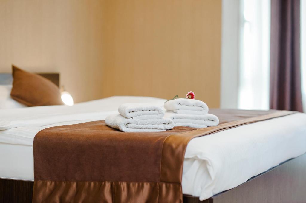 Postel nebo postele na pokoji v ubytování TipTop Hotel CITY CENTER