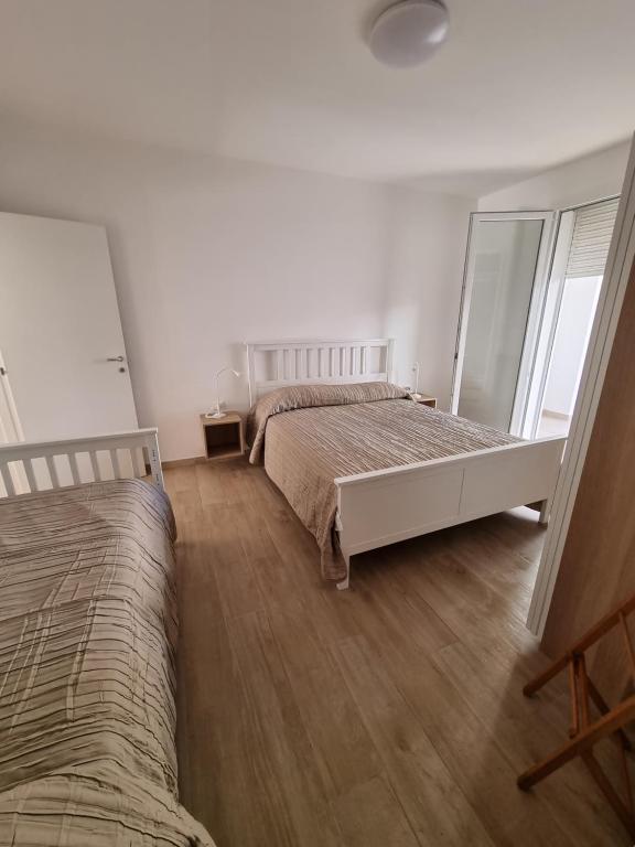 Postel nebo postele na pokoji v ubytování Pali's Rooms & Lodges