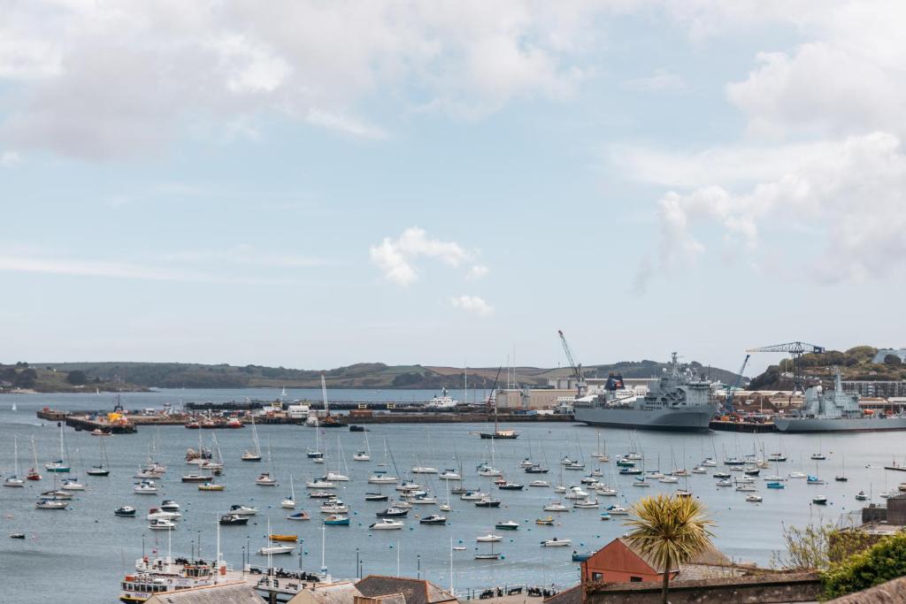 a bunch of boats are docked in a harbor at Stunning views over the beautiful Falmouth Harbour in Falmouth