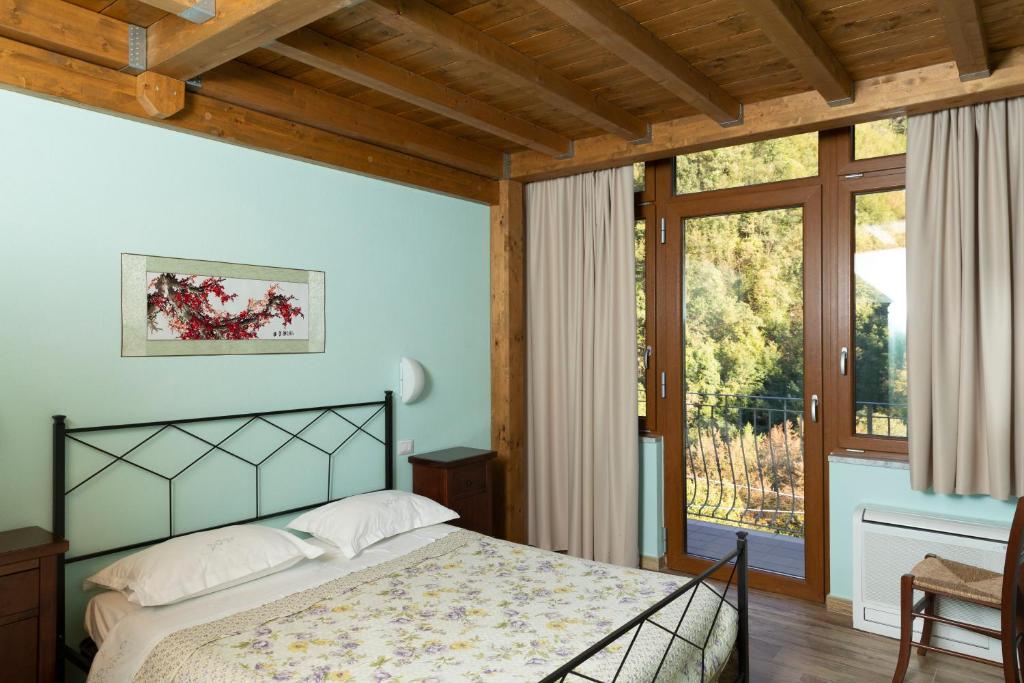 Ένα ή περισσότερα κρεβάτια σε δωμάτιο στο Agriturismo Cornali