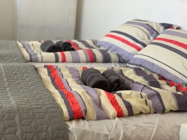 Posteľ alebo postele v izbe v ubytovaní Levendulakert Siófok Apartmanház