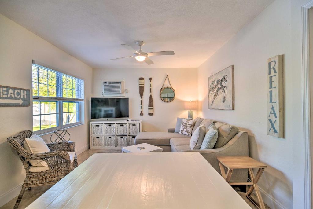 a living room with a couch and a table at Apartment with Easy Access to Indian Rocks Beach! in Clearwater Beach