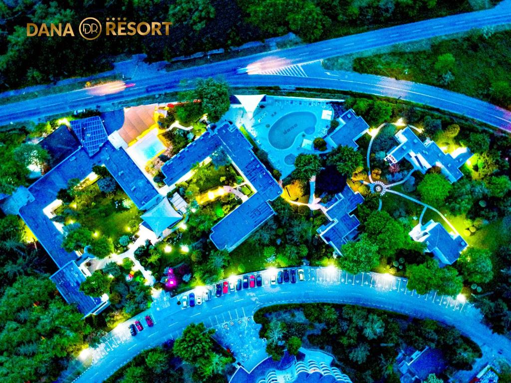 an overhead view of a swimming pool at night at Hotel Dana Resort in Venus