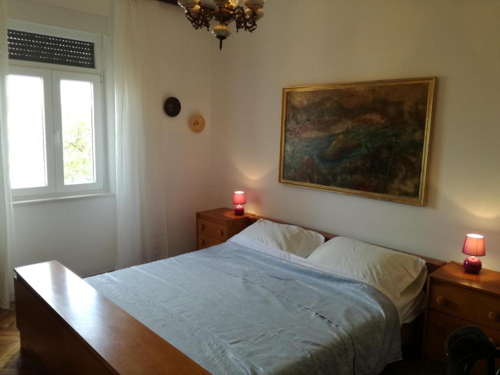 Postel nebo postele na pokoji v ubytování Villa Paula