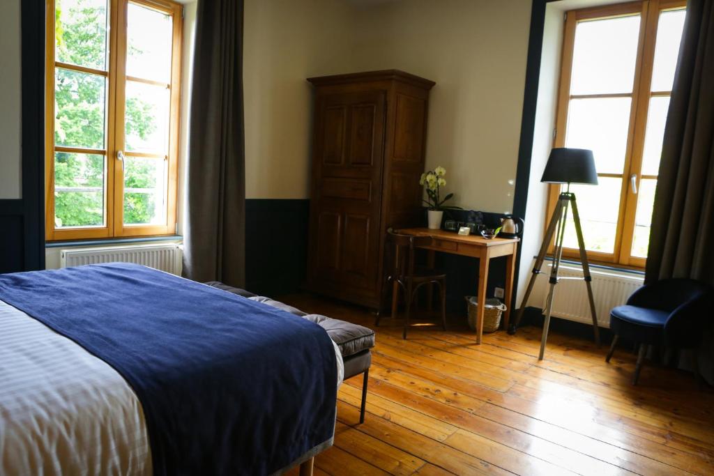 Postel nebo postele na pokoji v ubytování Arc en Sel Maison d’hôtes