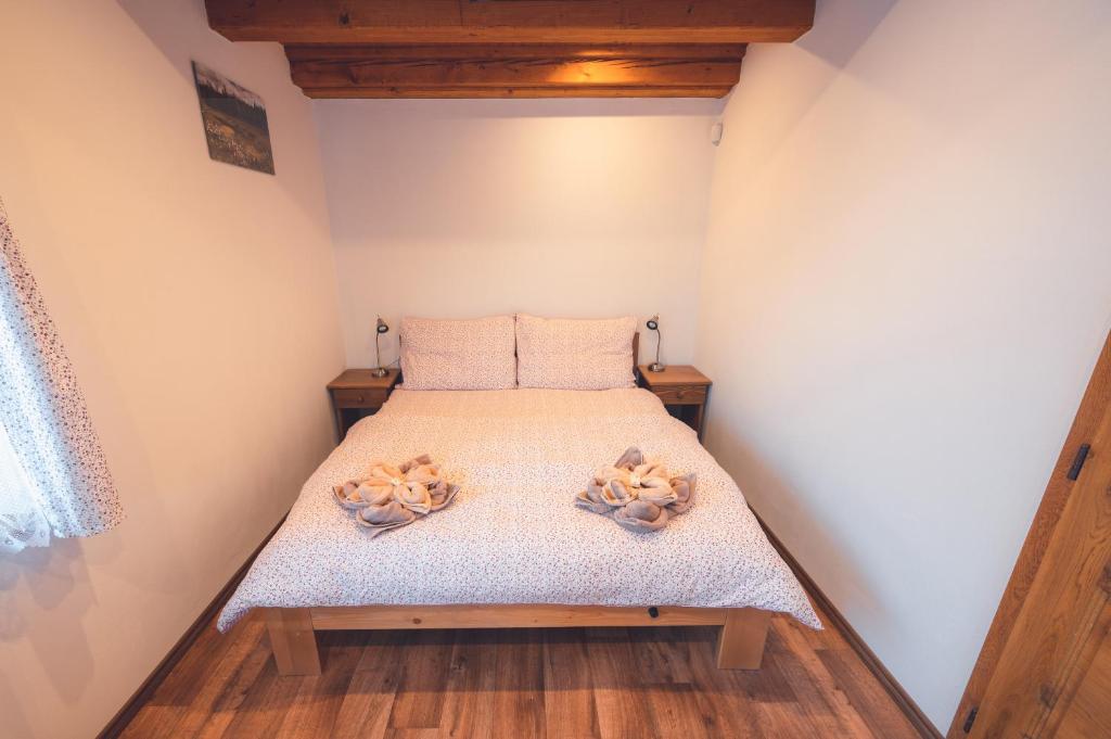 Postel nebo postele na pokoji v ubytování Penzion Horský statek