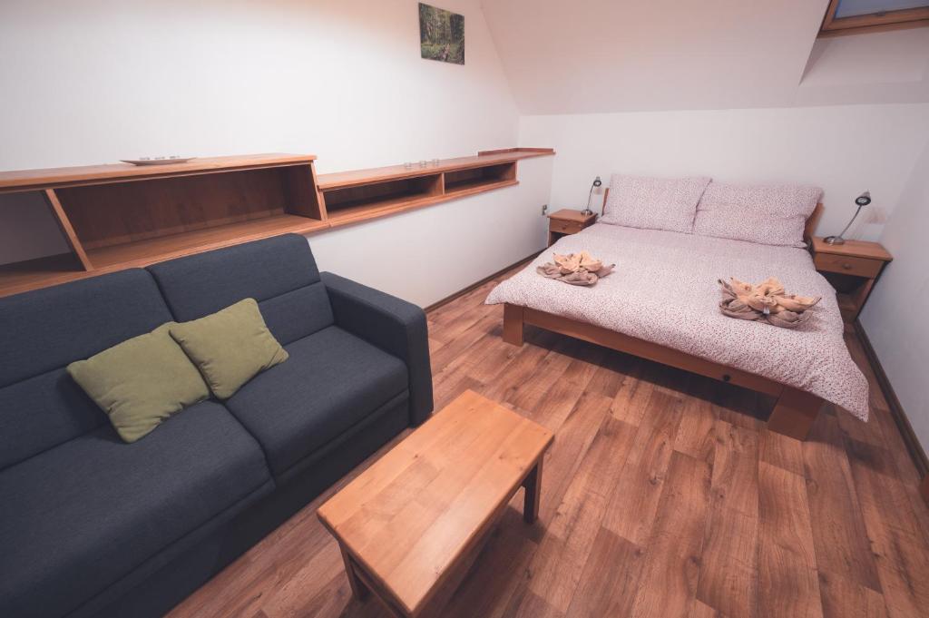 Postel nebo postele na pokoji v ubytování Penzion Horský statek