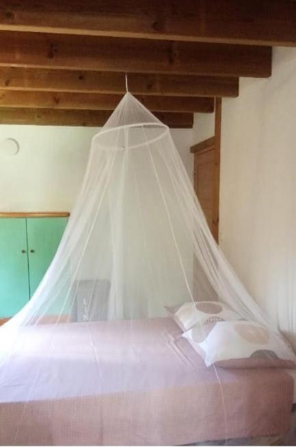 Postel nebo postele na pokoji v ubytování Un cosy sous le vent