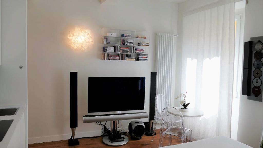 Televízia a/alebo spoločenská miestnosť v ubytovaní NOVELLA STYLE FLORENCE 2