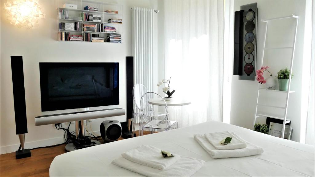 Televízia a/alebo spoločenská miestnosť v ubytovaní NOVELLA STYLE FLORENCE 2