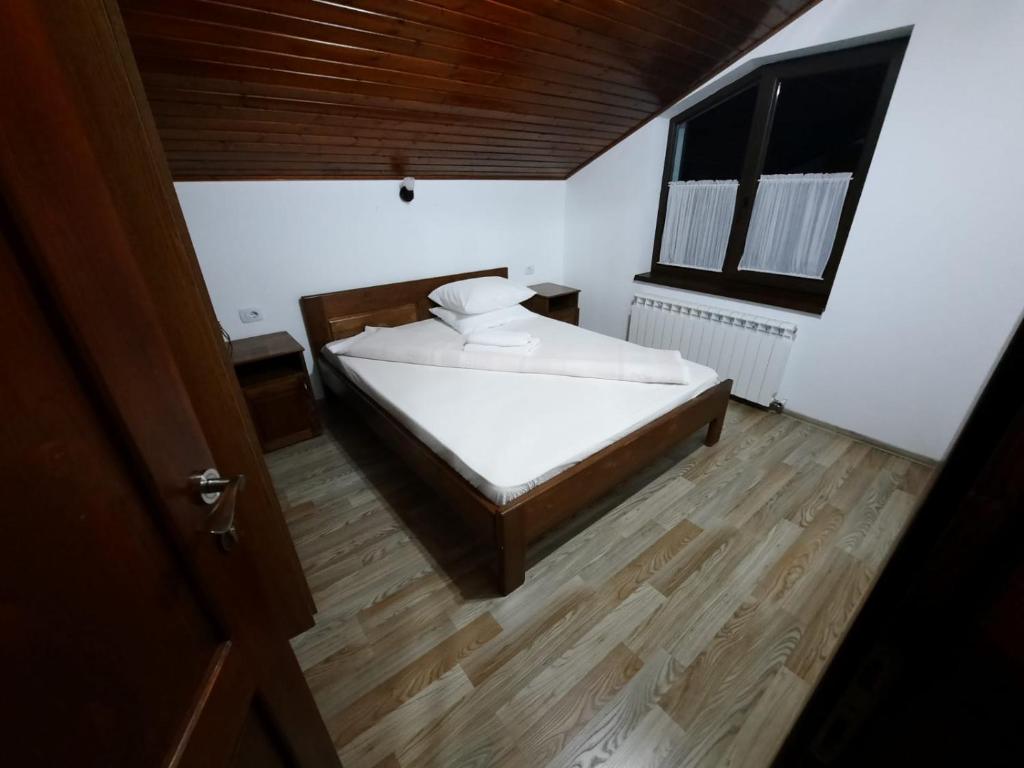Postel nebo postele na pokoji v ubytování Vila Aloman