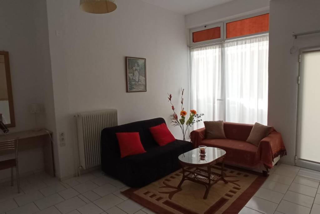 a living room with a couch and a table at Semith Home 1 in Kalabaka