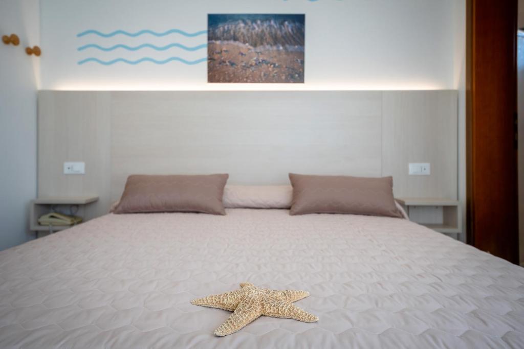Postel nebo postele na pokoji v ubytování Hotel Marisa