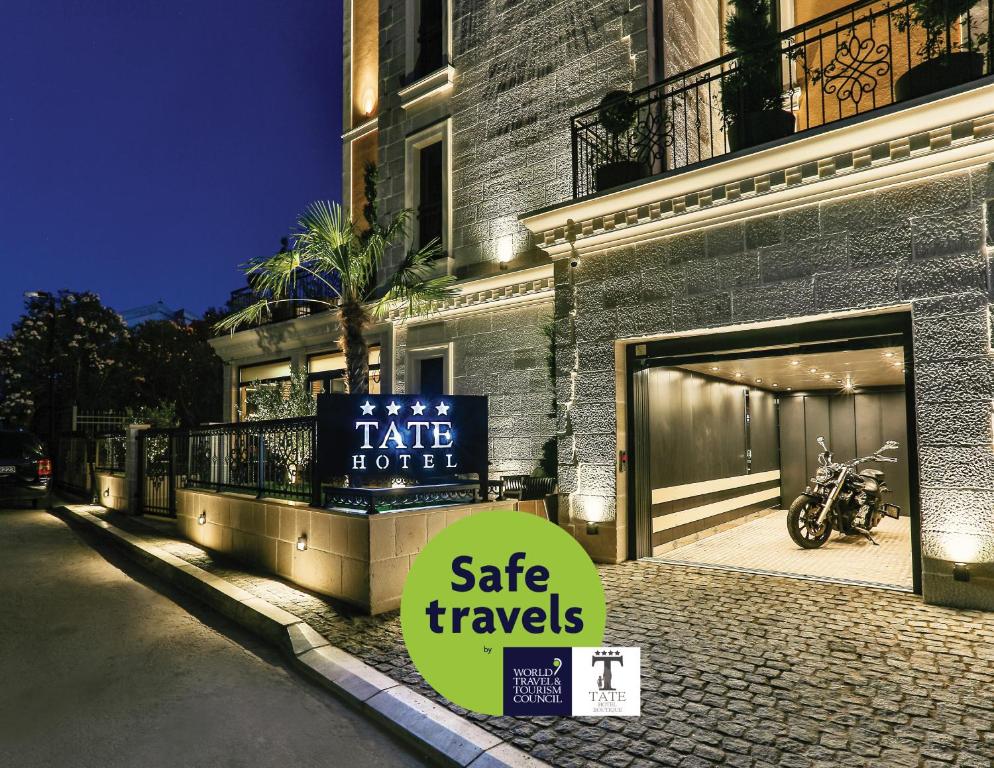 a building with a sign that says safe travels at Boutique Hotel Tate By Aycon in Budva