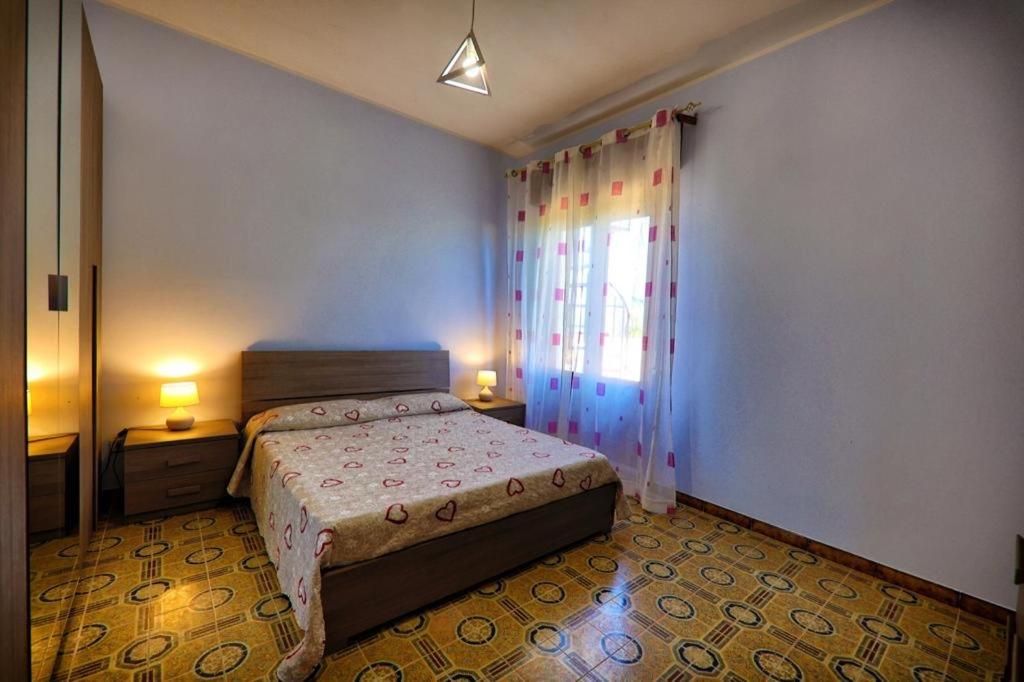 Postel nebo postele na pokoji v ubytování Villa Marzia & Villa Carmela