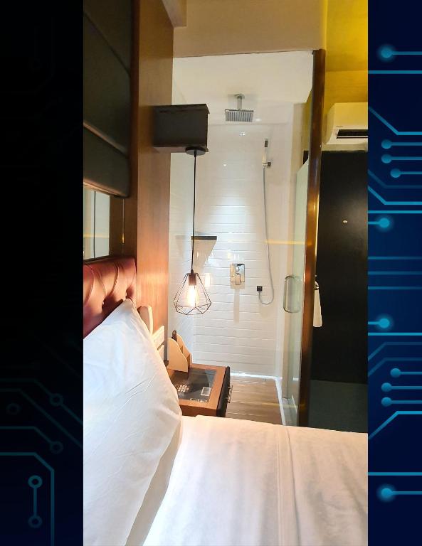 Postel nebo postele na pokoji v ubytování iOtel Luxury Kiosk Hotel