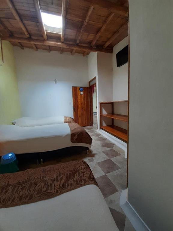 Postel nebo postele na pokoji v ubytování Hotel Campestre Inaoska Ecospa