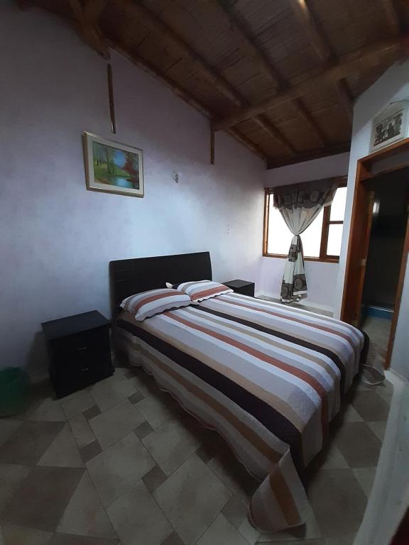 Postel nebo postele na pokoji v ubytování Hotel Campestre Inaoska Ecospa