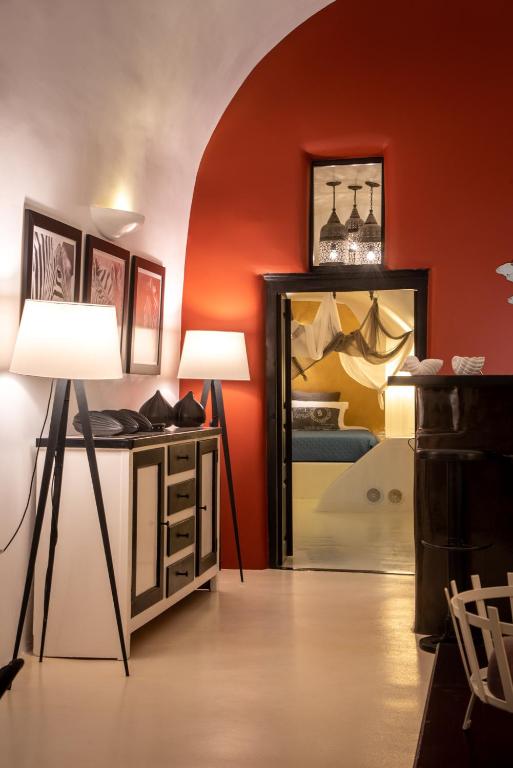 a room with two lamps and a mirror at Villa Orpheus Santorini in Megalokhori