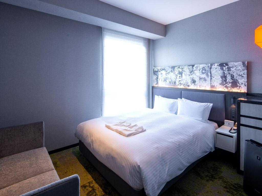 Postel nebo postele na pokoji v ubytování Hotel Forza Kyoto Shijo Kawaramachi