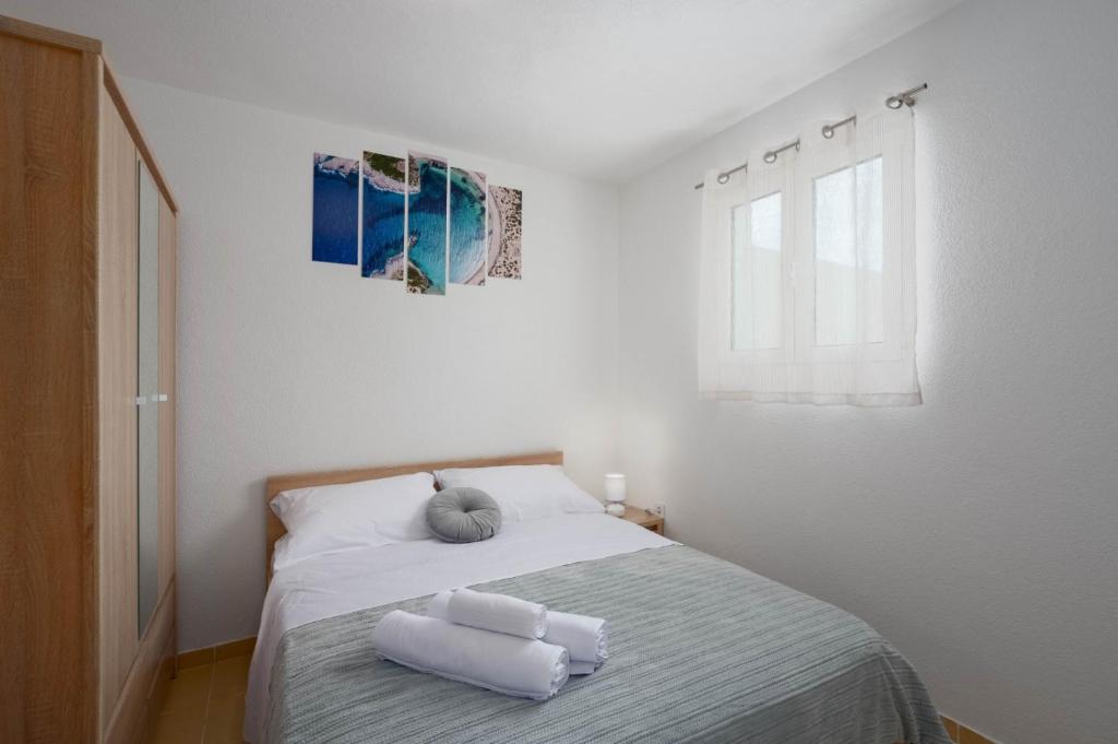 Postel nebo postele na pokoji v ubytování Holiday Home Drvenik