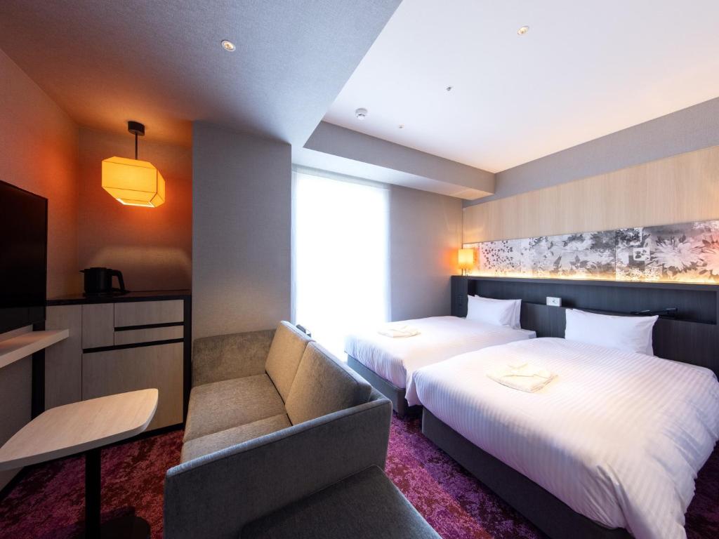 Postel nebo postele na pokoji v ubytování Hotel Forza Kyoto Shijo Kawaramachi