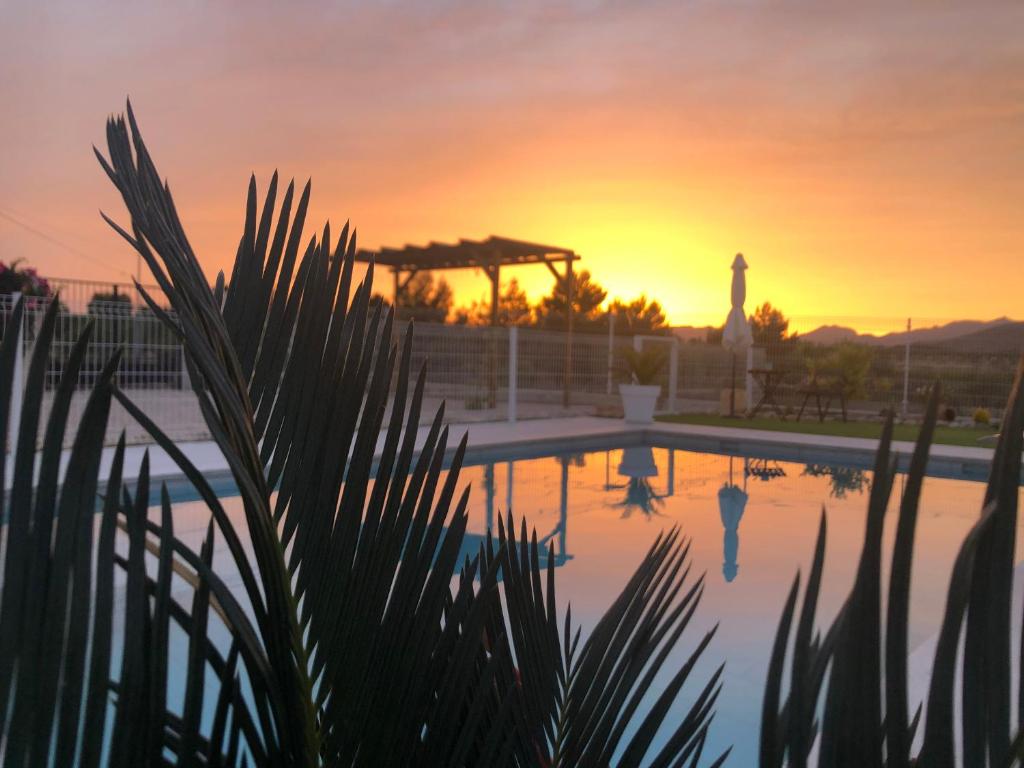 The sunrise or sunset as seen from the country house or nearby