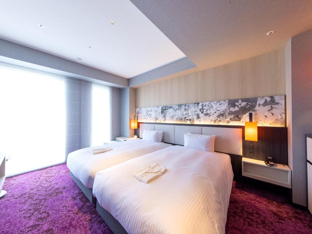 Postel nebo postele na pokoji v ubytování Hotel Forza Kyoto Shijo Kawaramachi