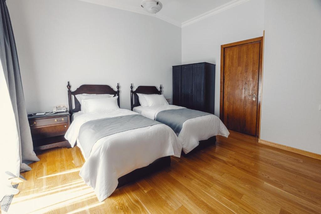 Postel nebo postele na pokoji v ubytování Octava Boutique Hotel