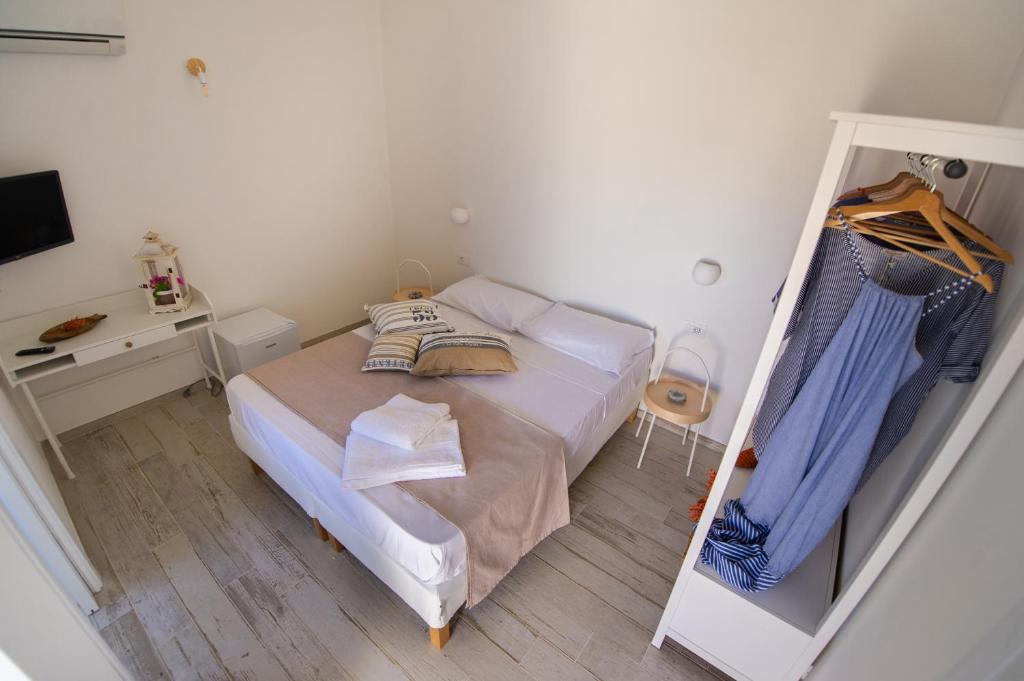 Postel nebo postele na pokoji v ubytování TiPino