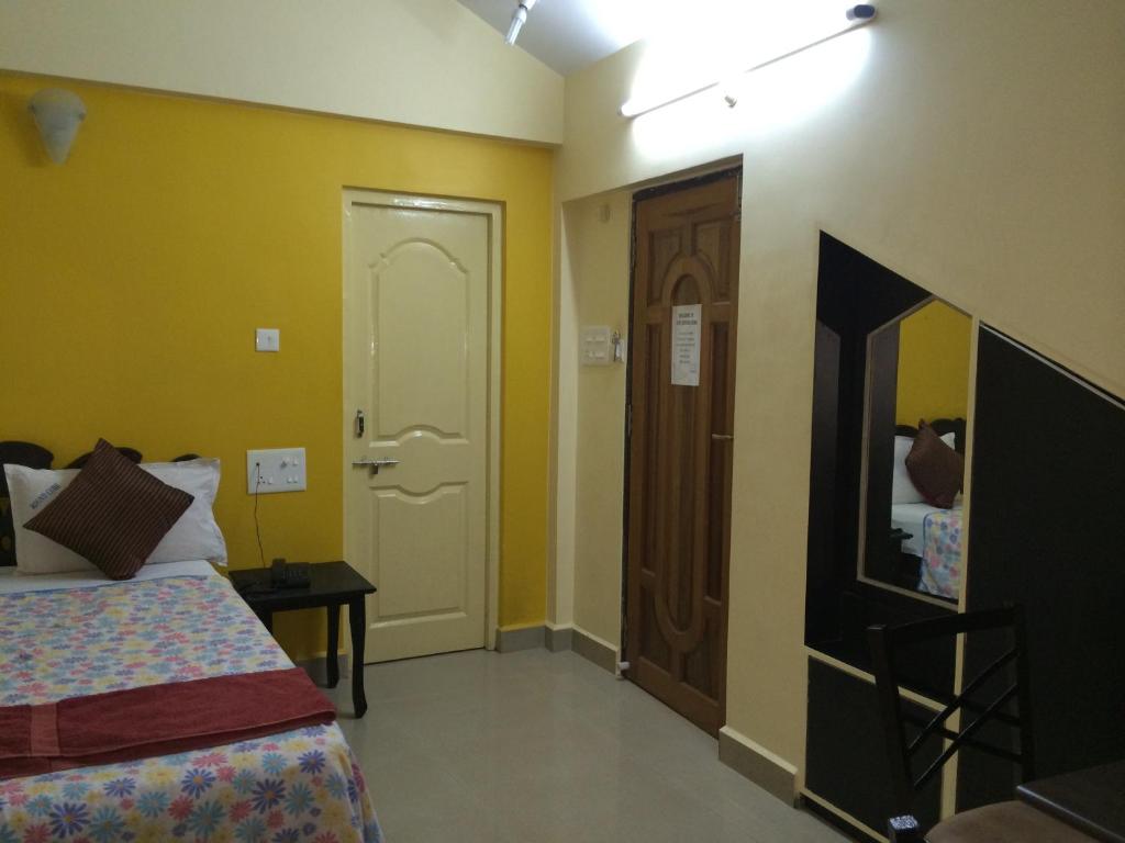Postel nebo postele na pokoji v ubytování Roundcube Guest House