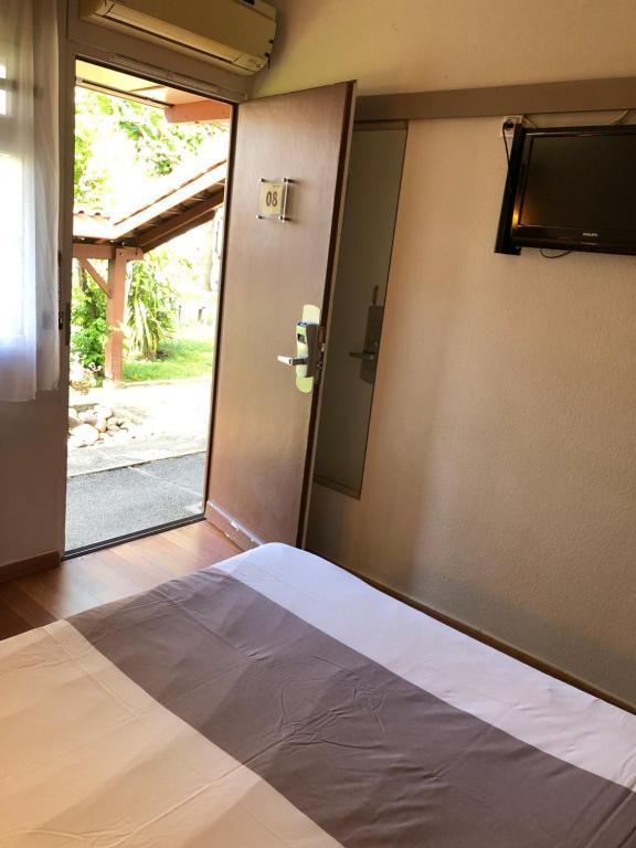 Postel nebo postele na pokoji v ubytování Hotel Cristol