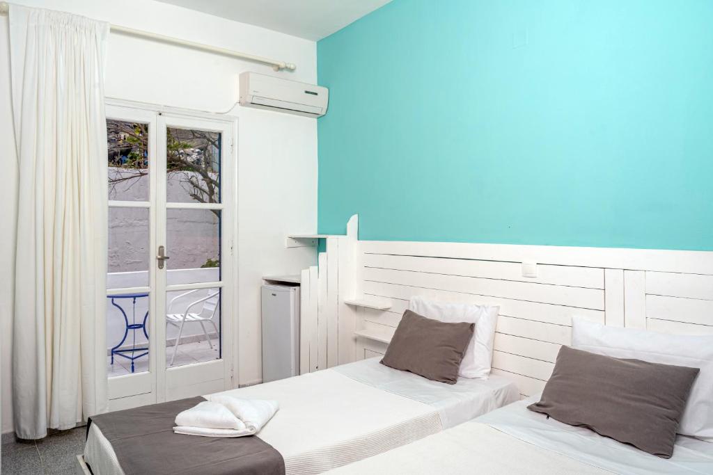 Letto o letti in una camera di Ikaros