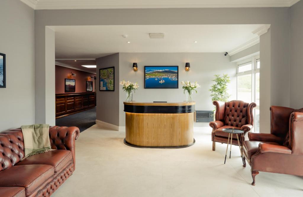 a lobby with a bar in the middle of a room at Hillgrove Guesthouse in Dingle